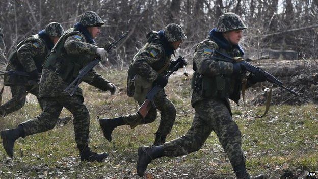 Ukrainian border guards train in the village of Alekseyevka on the Ukrainian-Russian border, 21 March