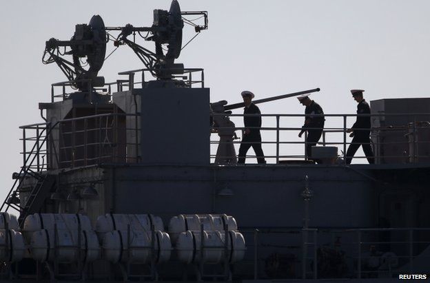 Ukrainian officers are seen on the deck of a Ukrainian naval ship at the Crimean port of Sevastopol, 22 March