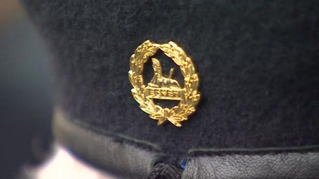 Badge on back of cap