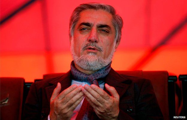 Presidential candidate Abdullah Abdullah prays at an election rally in Parwan province (20 March)