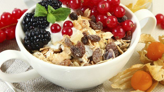 muesli and fruit in cereal bowl