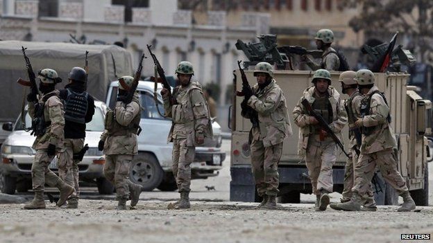 Policemen arrive at the site of an attack in Kabul