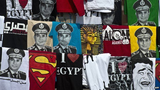 T-shirts bearing the image of ex-Field Marshal Abdul Fattah al-Sisi on sale in Cairo's Tahrir Square in October 2013