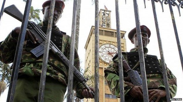 Two Kenyan guards patrol outside the parliament building in Nairobi - 27 March 2014