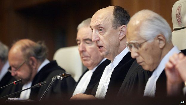 Judge Peter Tomka, centre, president of the International Court of Justice, delivers its verdict in The Hague, Netherlands, 31 March 2014