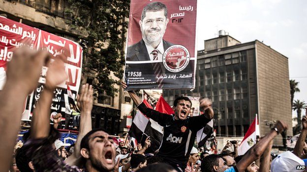 Supporters of Mohamed Morsi, the Muslim Brotherhood's candidate, protest against Egypt's military rulers in Tahrir Square and celebrate a premature presidential election victory in Cairo, Egypt, on 23 June 2012.