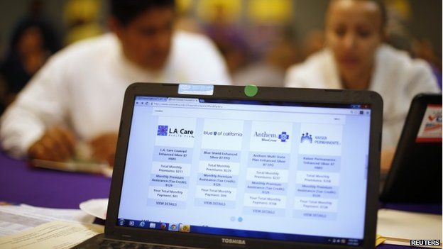 People sign up for health insurance at an enrolment event in Cudahy, California 27 March 2014