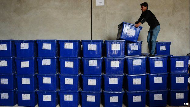 Afghan election worker stacks ballot boxes in Mazar-e Sharif, northern Afghanistan (1 April)