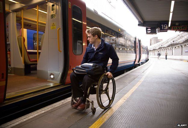 Man in wheelchair at Waterloo station - image for illustration purposes
