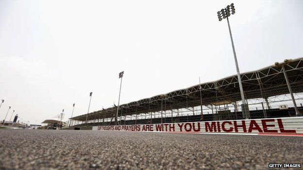 A message of support for former F1 World Champion Michael Schumacher is seen along the armco on the main straight during previews for the Bahrain Formula One Grand Prix