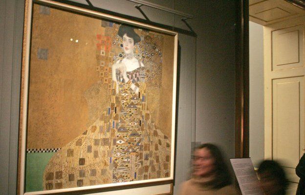 Gustav Klimt's portrait of Adele Bloch-Bauer on the wall of a gallery