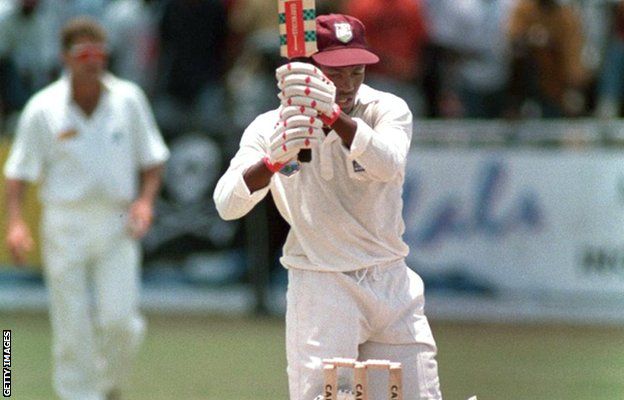 Brian Lara scores four to break the world record but, as this picture shows, he dislodged the bails in the process