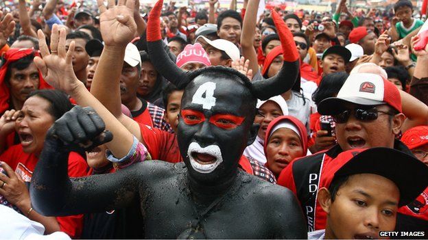 A man dressed as the bull mascot at a rally for Indonesia's Democratic Party of Struggle