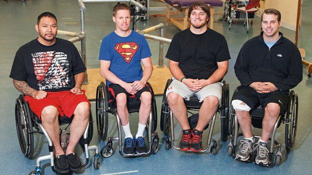 Four men in wheelchairs