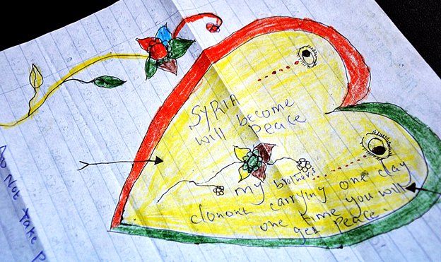 A colourful heart has been drawn on a piece of paper