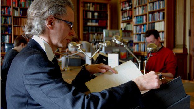 Royal Society librarian Keith Moore reading Sylva (Image: BBC)