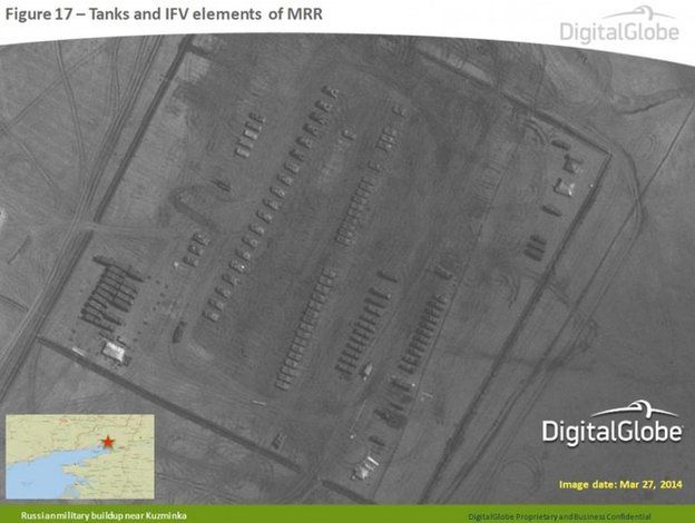 Satellite image taken 27 March 2014, and provided by Supreme Headquarters Allied Powers Europe (SHAPE) on 9 April 2014, shows what are purported to be Russian military tanks and vehicles at a military base near Kuzminka, east of the Sea of Azov in southern Russia.