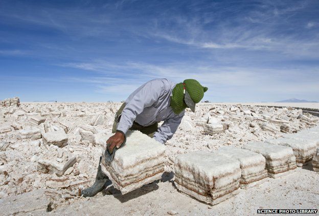 Harvesting salt crust in Salar de Uyuni