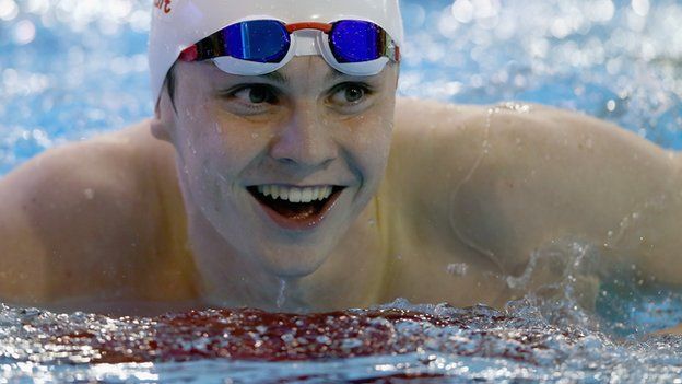 Ross Murdoch smiles after victory in the men's 100m breaststroke final