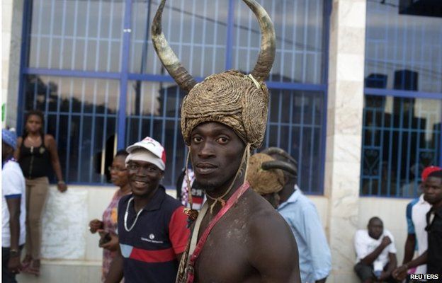 A traditional Balanta performer dances at a campaign rally for presidential candidate Nuno Gomes Nabiam in Bissau on 11 April