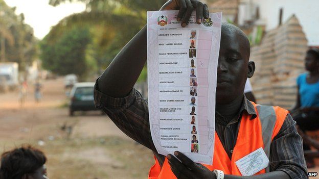 Guinea-Bissau voter holds up ballot paper