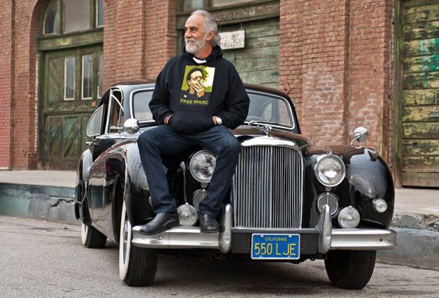 Tommy Chong sitting on his Jag