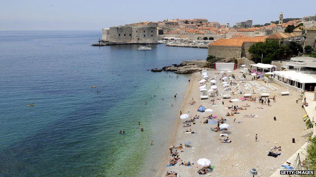 Tourists enjoy the summer on the main beach of Croatia's central Adriatic resort of Dubrovnik on in June 2009.