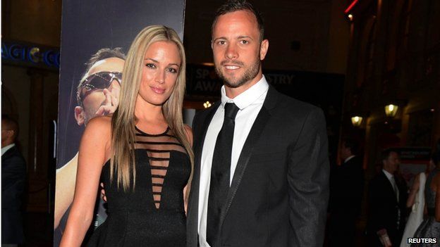File photo: Oscar Pistorius (right) and his girlfriend Reeva Steenkamp pose for a picture in Johannesburg, 7 February 2013