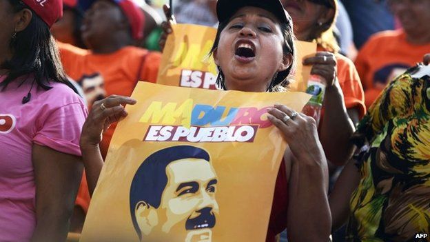 Supporters of Venezuelan President Nicolas Maduro are seen during an event celebrating his first year of government at Miraflores presidential palace in Caracas on 15 April, 2014