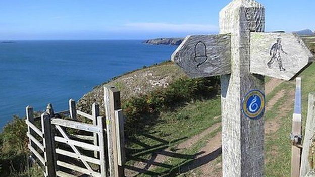 Path sign and path towards St Justinians, Pembrokeshire