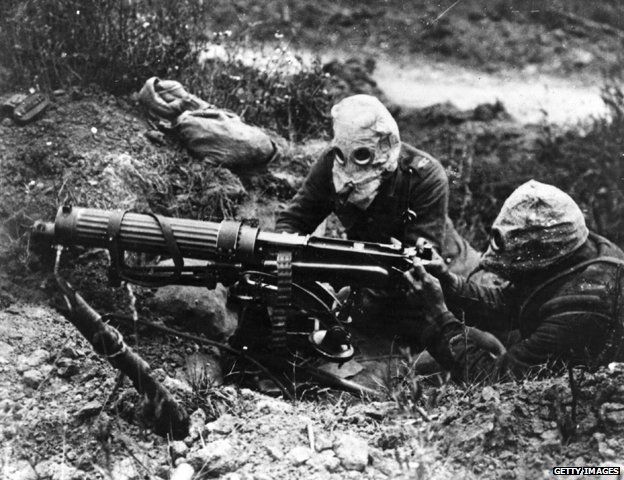 Gas-masked men of the British Machine Gun Corps with a Vickers machine gun during the first battle of the Somme.