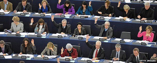 Members of the European Parliament take a vote during a sitting in Strasbourg