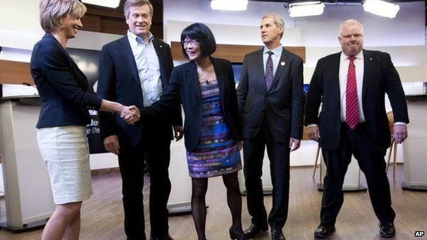 Karen Stintz, (left to right) John Tory, Olivia Chow, David Soknacki and Rob Ford shake hands before the first Toronto mayoral debate in Toronto on 26 March 2014