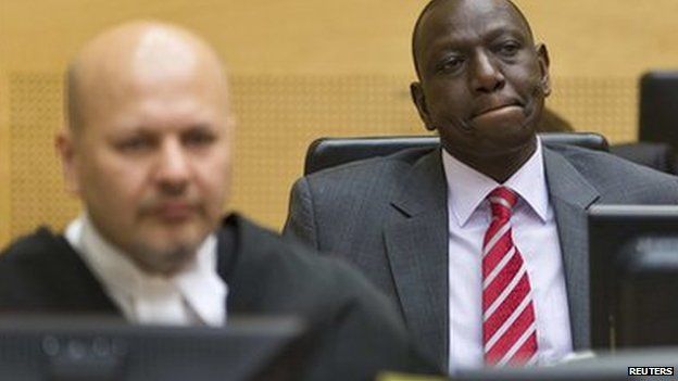 Kenya's Deputy President William Ruto (R) reacts as he sits in the courtroom before his trial at the International Criminal Court in The Hague (10 September 2013)