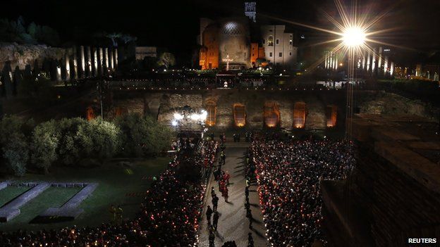 Pope Francis leads the Via Crucis (Way of the Cross) torchlight procession celebrated in front of the Colosseum on Good Friday in Rome, Friday, April 18