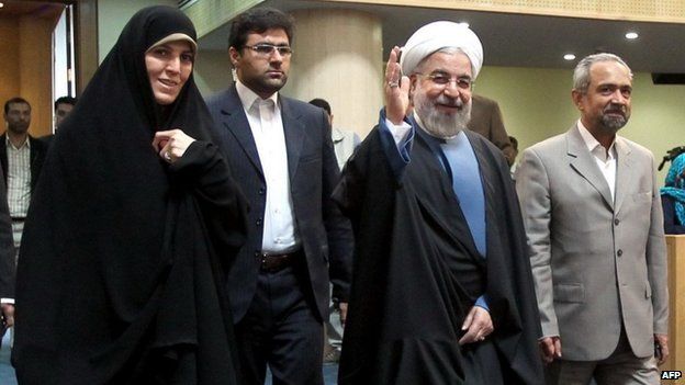 Iranian President Hassan Rouhani (second right) at a forum to mark Women's Day in Iran, 20 April 2014