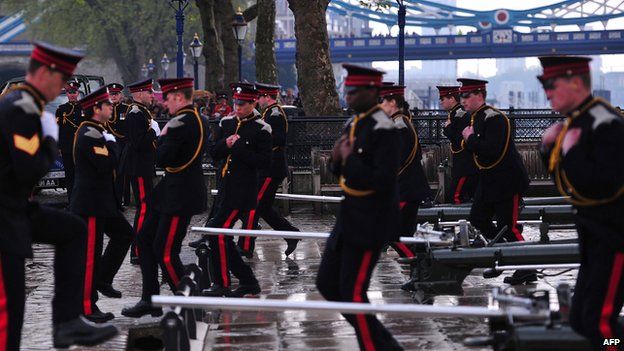Soldiers prepare to fire a salute at the Tower of London