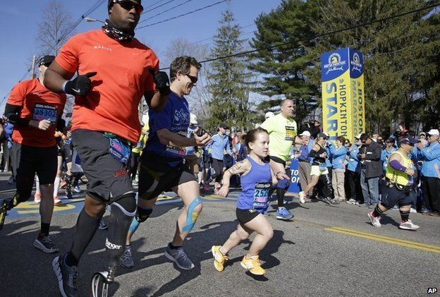 Mobility impaired runners leave the start line at the Boston Marathon, April 21