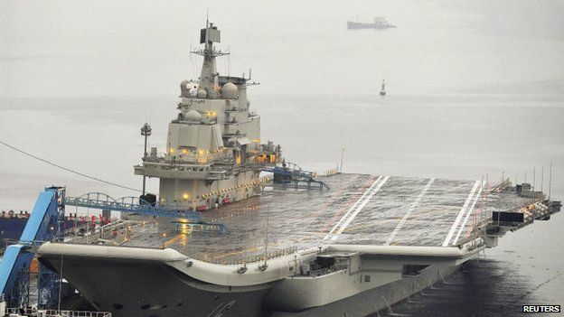 China's first aircraft carrier - the 60,000-tonne Liaoning, which was renovated from an old aircraft carrier that China bought from Ukraine in 1998 - is seen docked at Dalian Port, in Dalian, Liaoning province (September 2012)