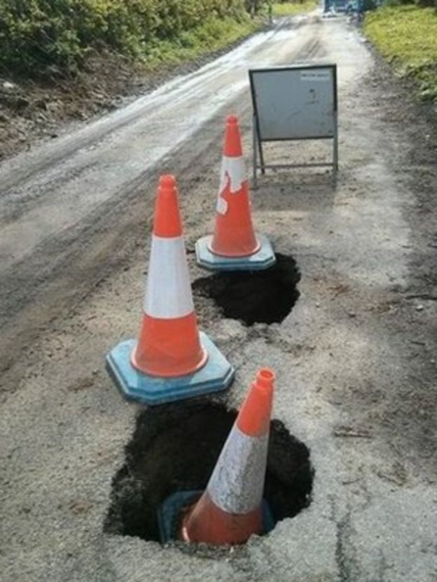 Wiltshire road closed after badgers tunnel through surface BBC News