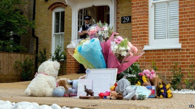 Teddies, bouquets, pot plants and a child's skipping rope were among items laid on the driveway of the house