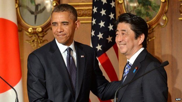 US President Barack Obama shakes hands with Japanese Prime Minister Shinzo Abe following a bilateral press conference at the Akasaka Palace in Tokyo on 24 April 2014