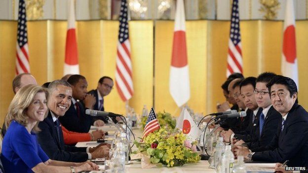 US President Barack Obama speaks to Japanese Prime Minister Shinzo Abe during their meeting at the Akasaka Palace in Tokyo on 24 April 2014