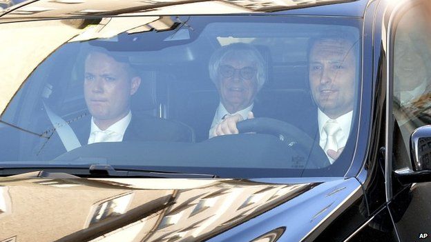 Bernie Ecclestone (centre) arrives in court