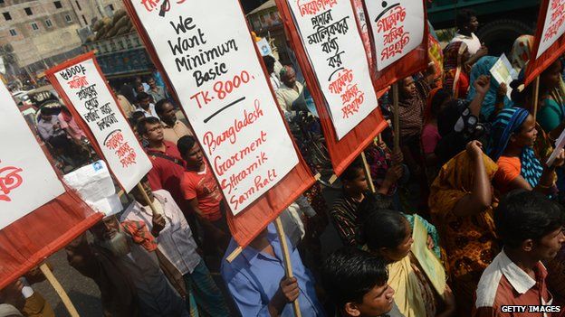 Survivors and relatives of Bangladeshi garment workers killed in the Tazreen Fashions fire accident and Rana Plaza garment factory building collapse gather during a demonstration in Savar, on the outskirts of Dhaka on November 24, 2013