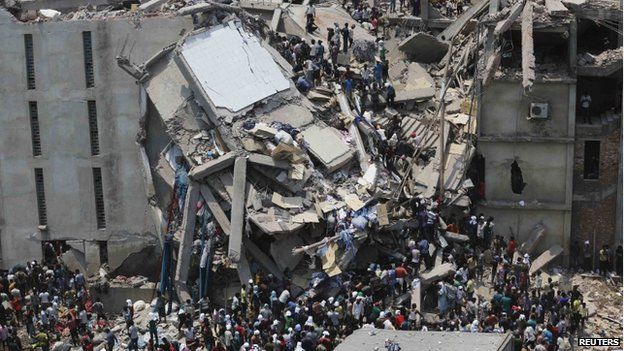 People rescue garment workers trapped under rubble at the Rana Plaza building after it collapsed, in Savar, 30 km (19 miles) outside Dhaka in this April 24, 2013 file photo.