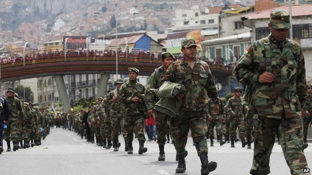 Air Force and Army soldiers march on the third day of protests in La Paz, Bolivia. 24 April 2014