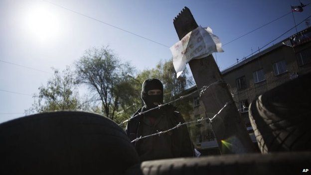 A man behind a barricade outside local government buildings in Horlivka