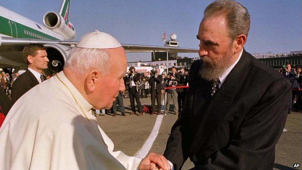 Cuban President Fidel Castro, right, greets Pope John Paul II after arriving at the Jose Marti Airport on 21 January 1998