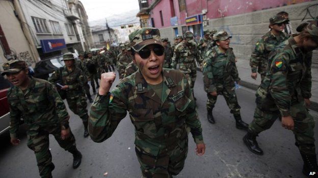 A female Air Force Sergeant joins the third day of protests by low ranking soldiers in La Paz, April 24, 2014.